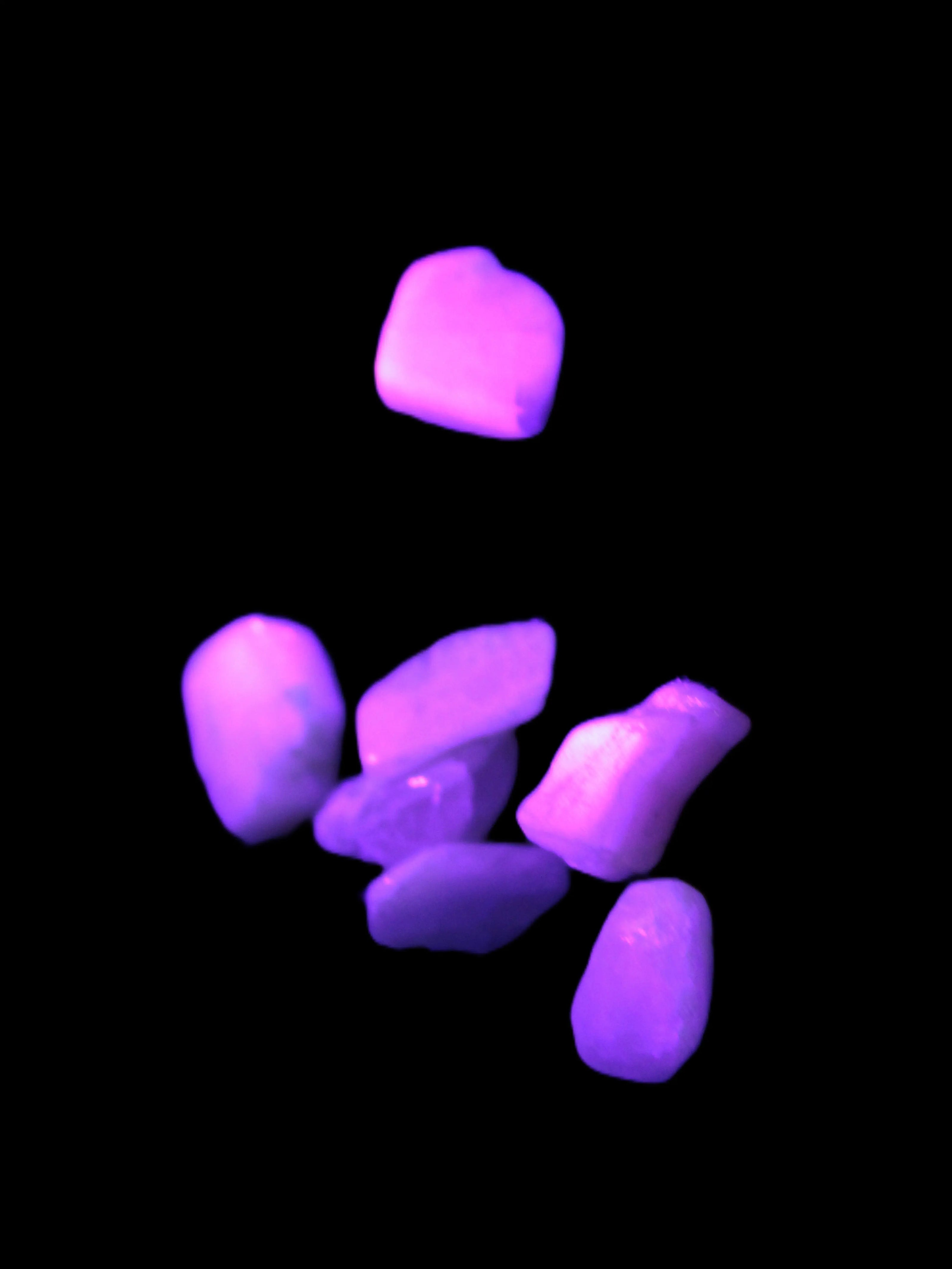 Small polished Kunzite crystals 6-8g in UV light