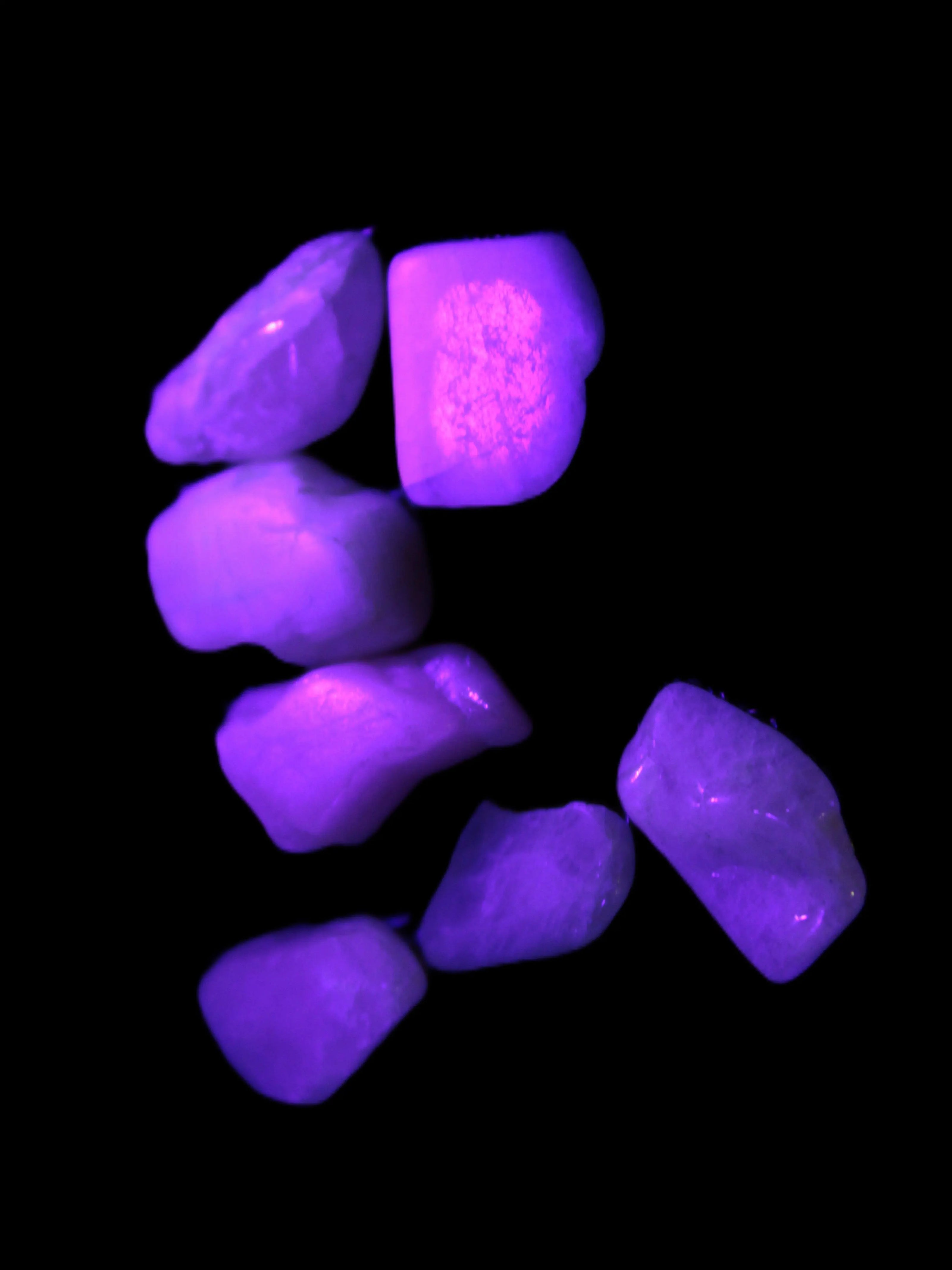 Small polished Kunzite crystals 6-8g in UV light