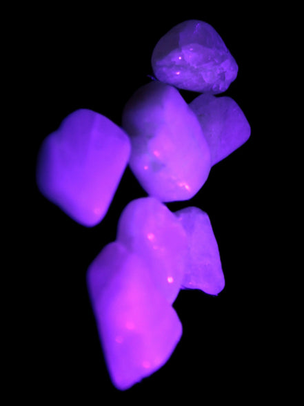 Small polished Kunzite crystals 6-8g in UV light