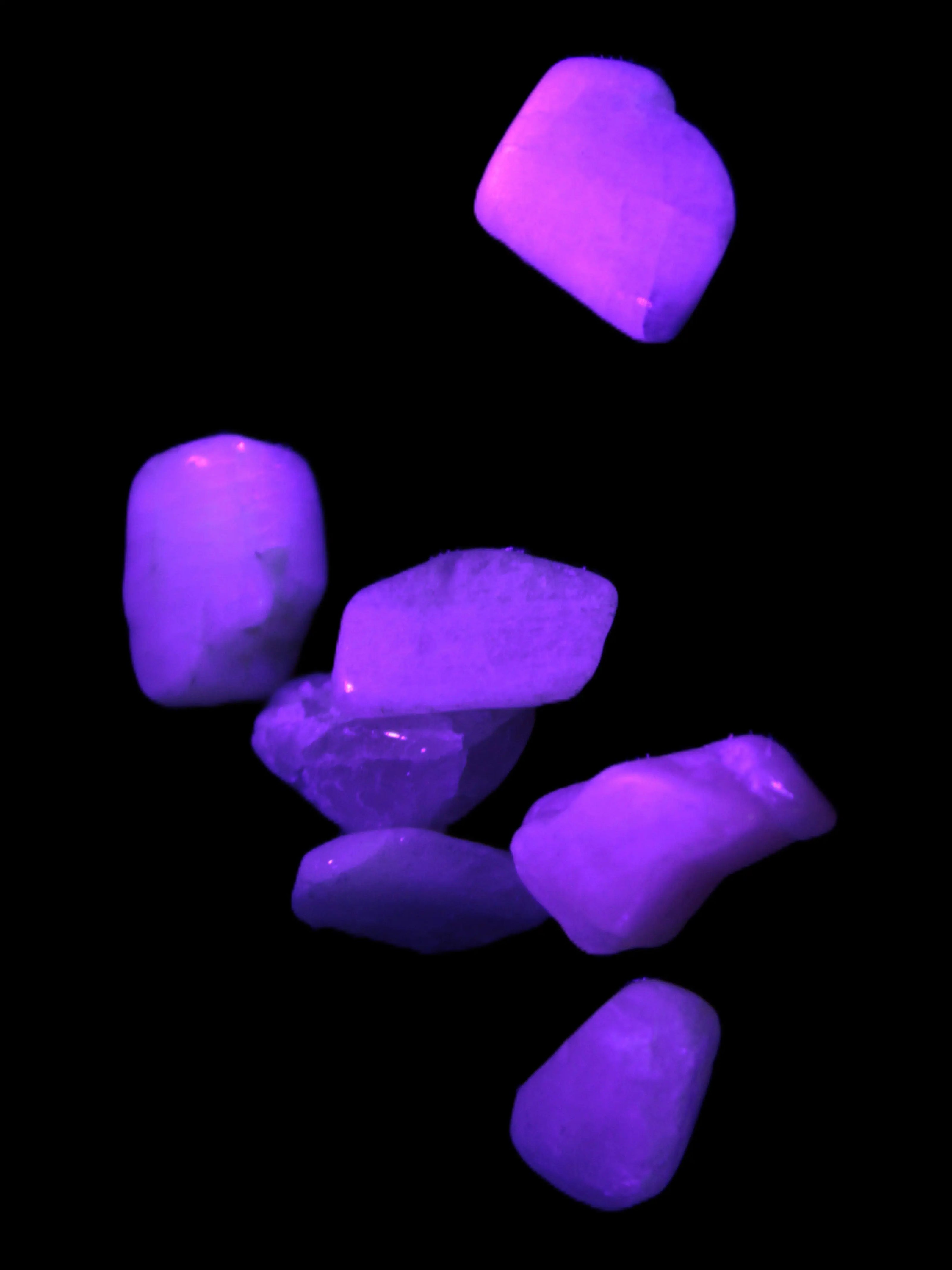 Small polished Kunzite crystals 6-8g in UV light