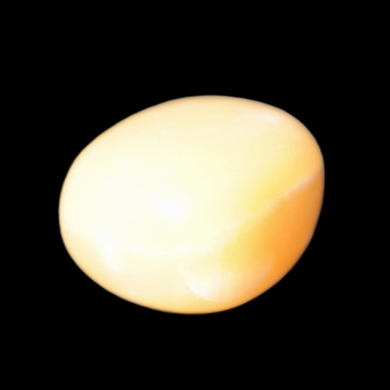 Lemon Calcite tumbled stone 25-30g in sunlight - Rocks and Things Store