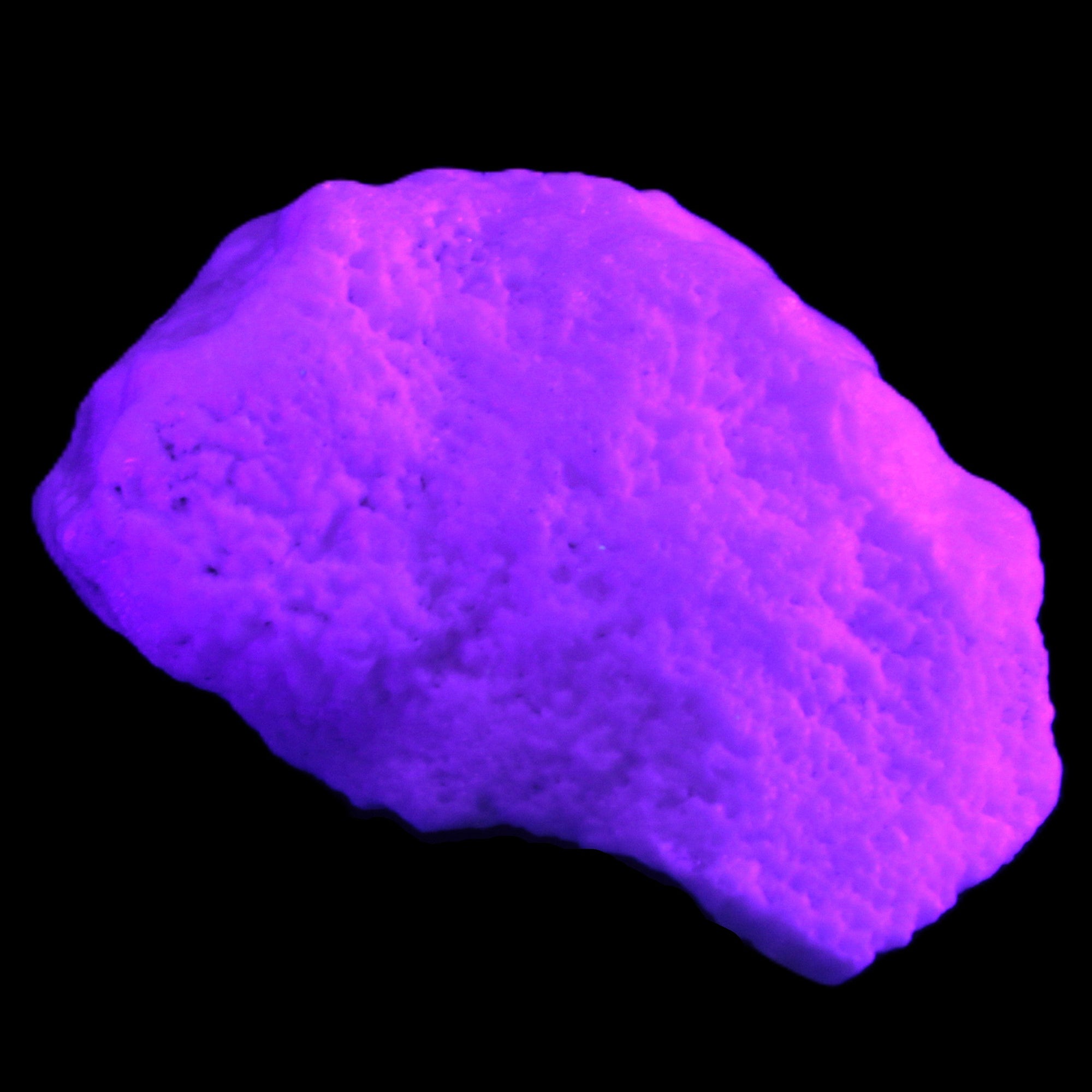 Pink Aragonite specimen from Pakistan 62*22*51mm 76.5g in UV light -  Rocks and Things Store