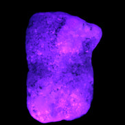 Pink Aragonite specimen on Ironstone matrix  43*22*23mm 49.4g in UV light