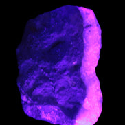 Pink Aragonite specimen on Ironstone matrix  43*22*23mm 49.4g in UV light - Rocks and Things Store