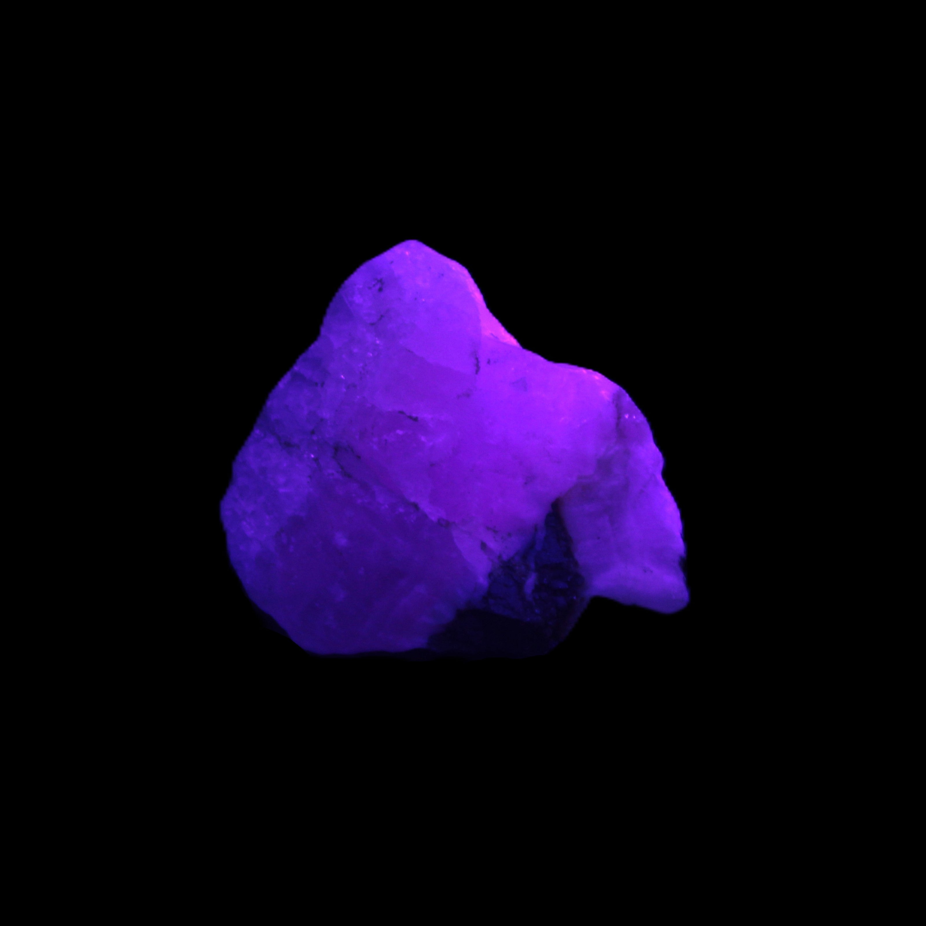 Pink Aragonite specimen from Pakistan 12-21g in UV light Rocks and Things Store