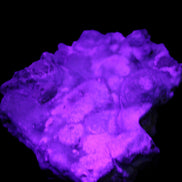 Blue Aragonite Caribbean Calcite specimen 95*55*93mm 343g in UV light - Rocks and Things Store