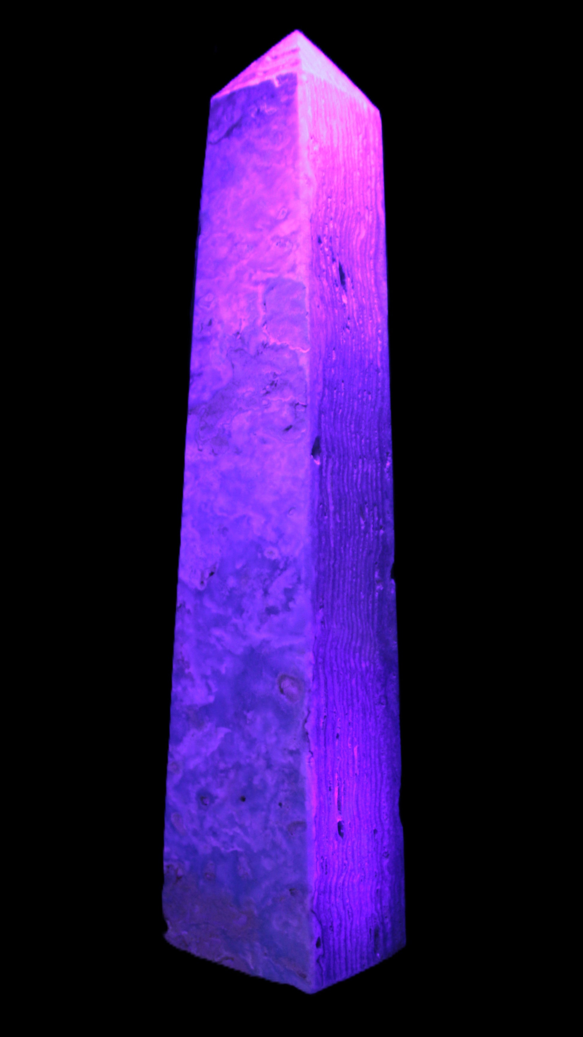 Caribbean Calcite obelisk 348*55*75mm 2574g in UV light - Rocks and Things Store