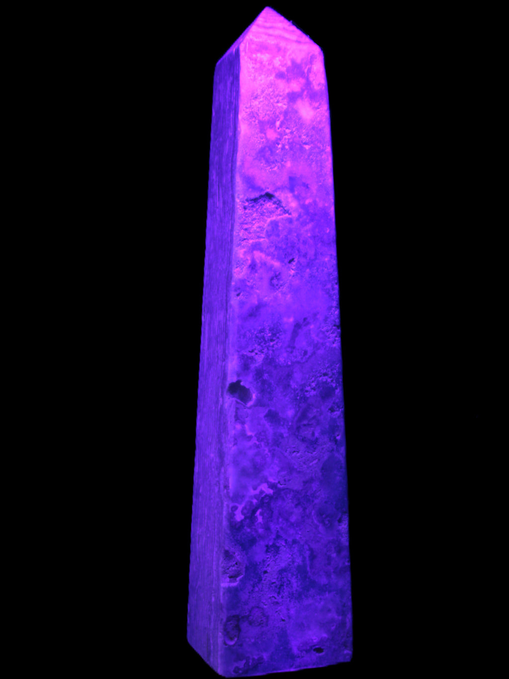 Caribbean Calcite obelisk 348*55*75mm 2574g in UV light - Rocks and Things Store