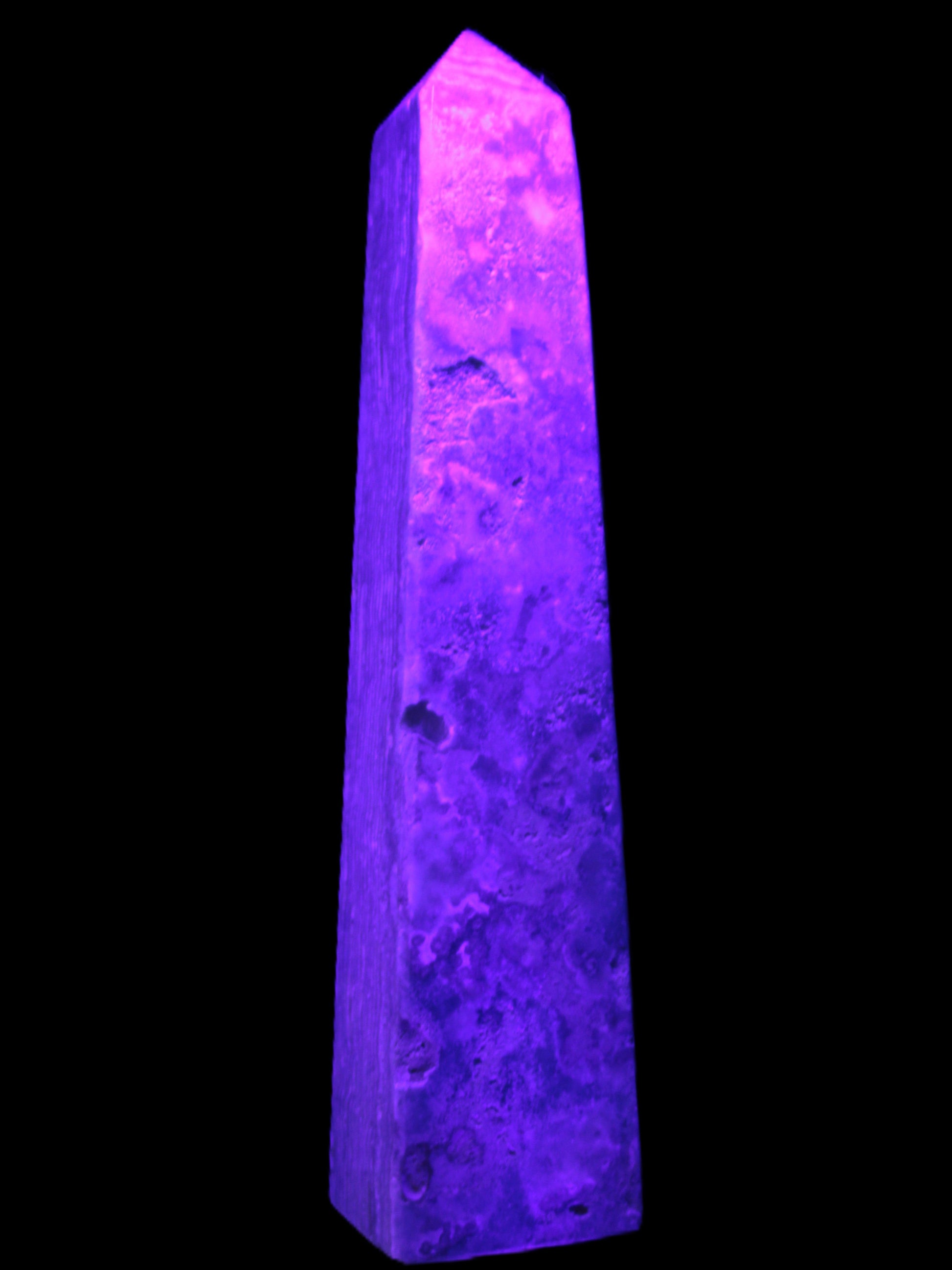 Caribbean Calcite obelisk 348*55*75mm 2574g in UV light - Rocks and Things Store