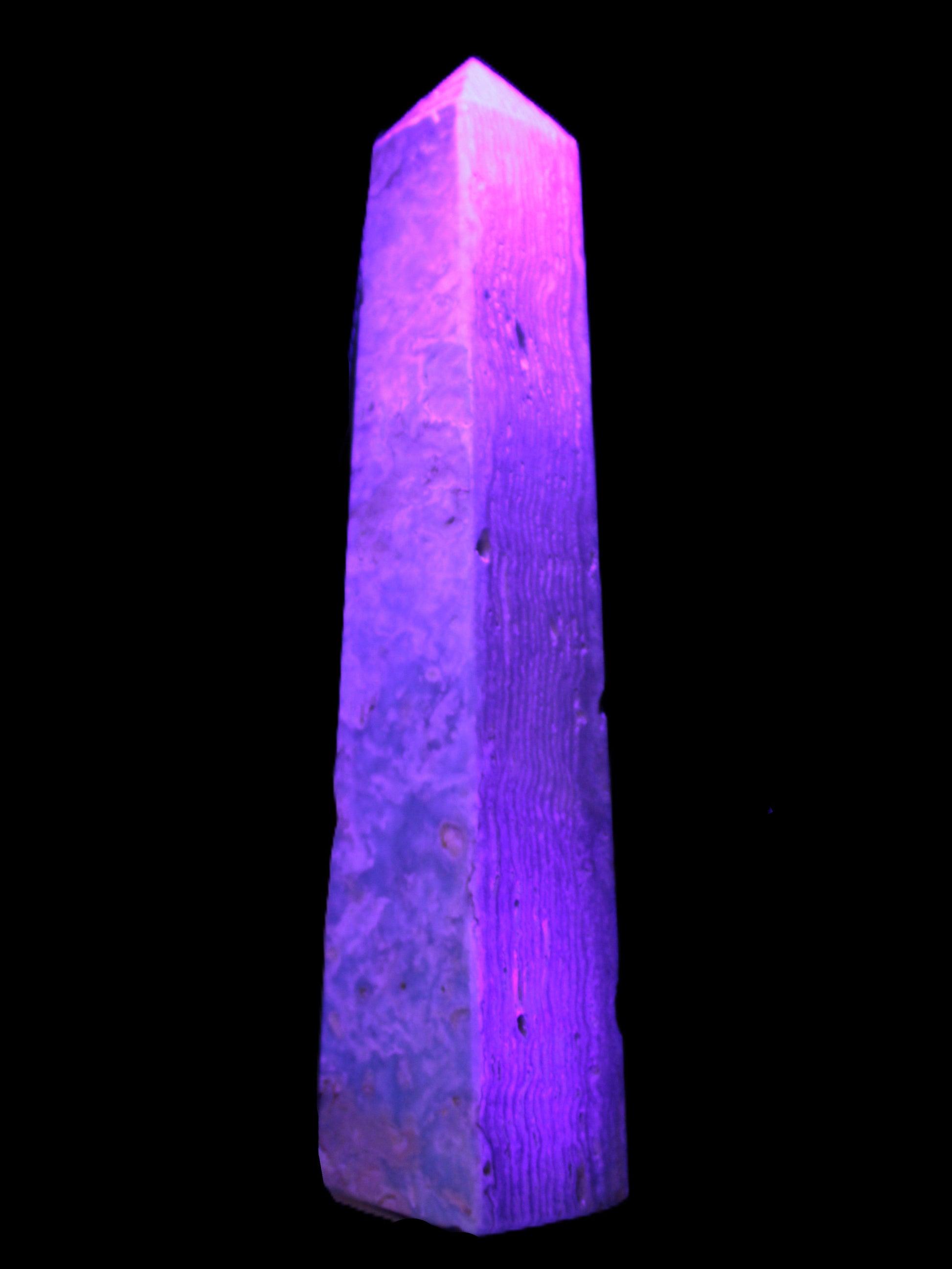 Caribbean Calcite obelisk 348*55*75mm 2574g in UV light - Rocks and Things Store