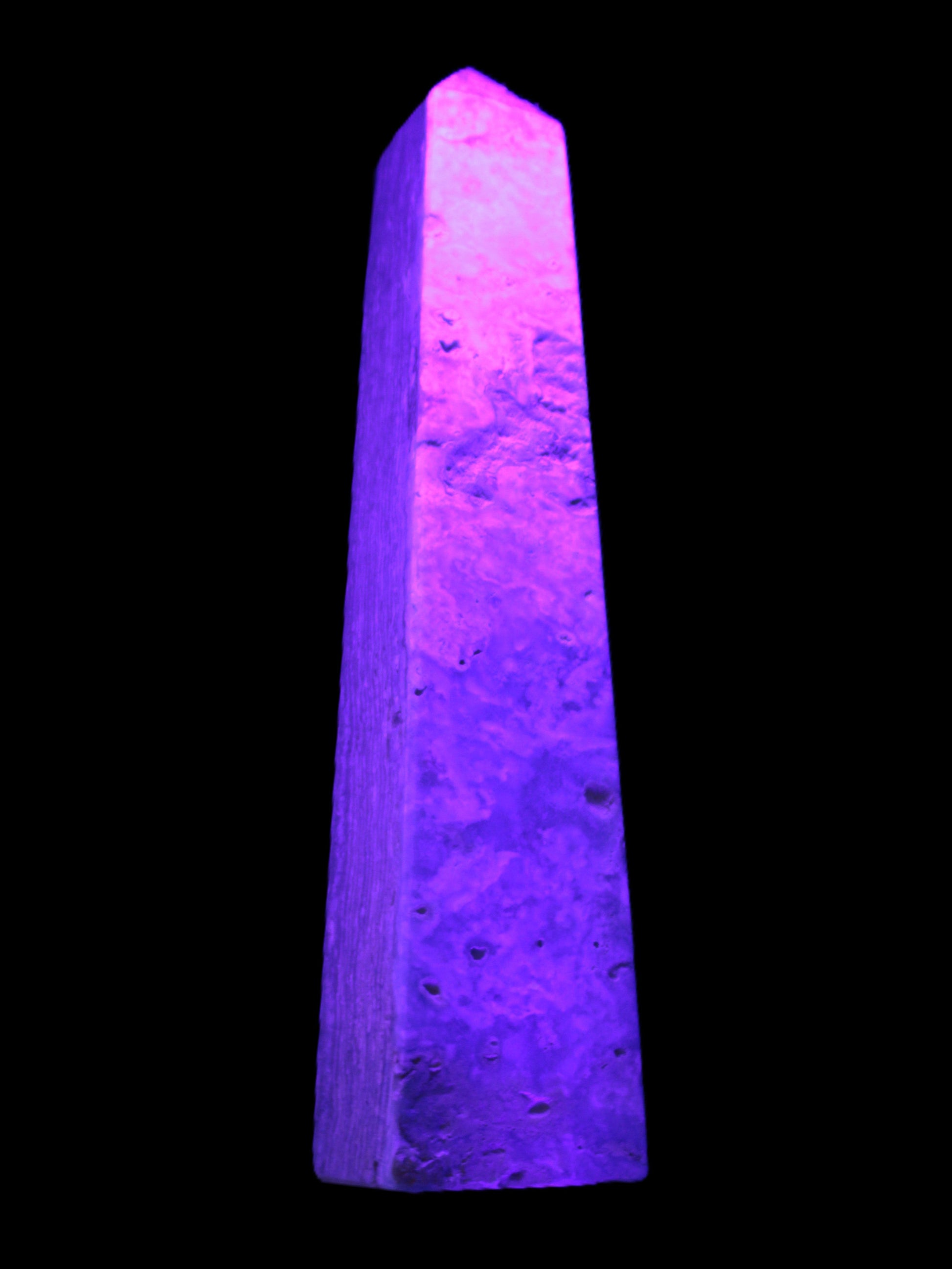 Caribbean Calcite obelisk 348*55*75mm 2574g in UV light - Rocks and Things Store
