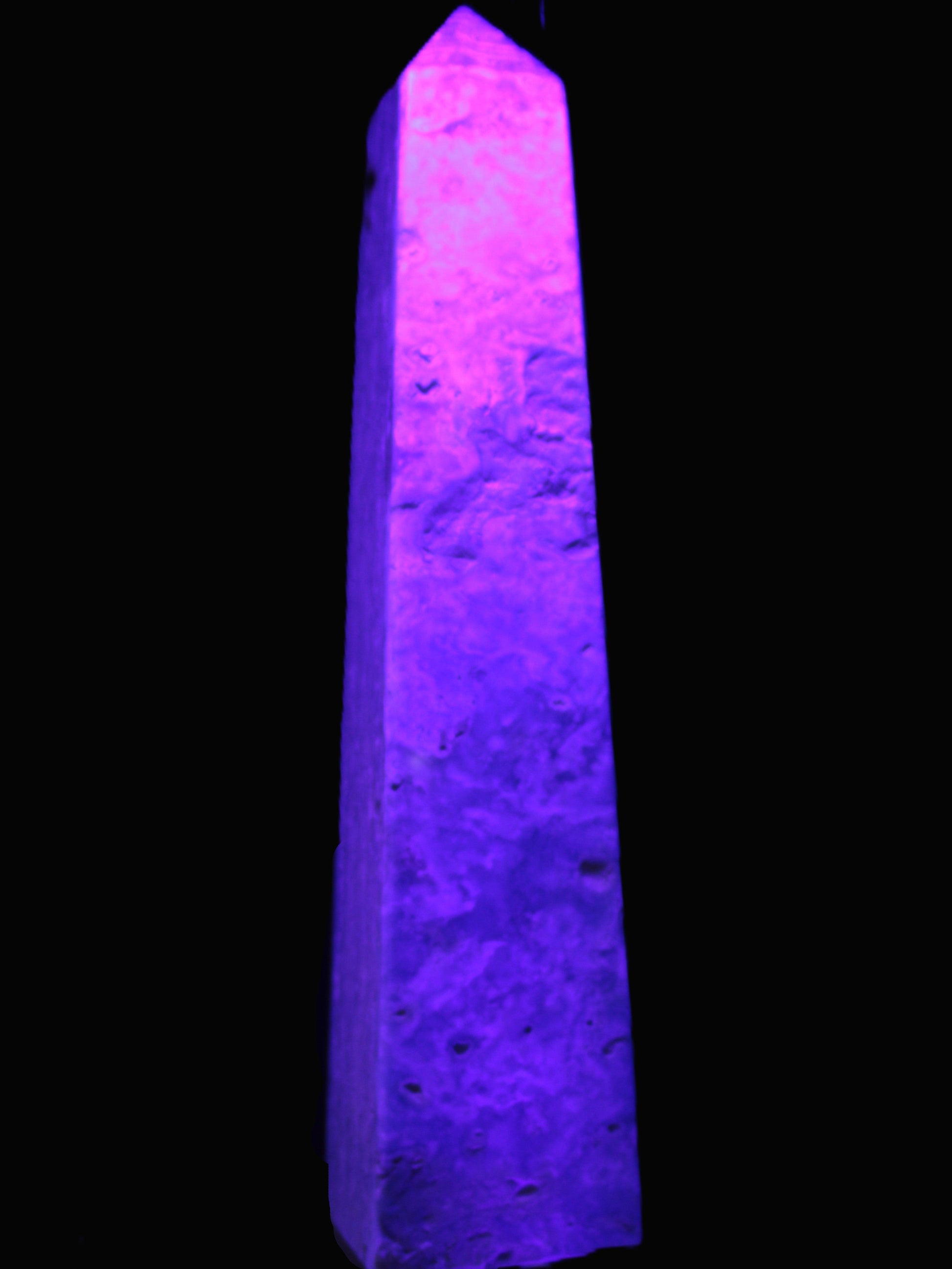 Caribbean Calcite obelisk 348*55*75mm 2574g in UV light - Rocks and Things Store