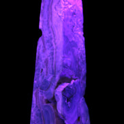 Caribbean Calcite obelisk 228*55*67mm 1554g in UV light - Rocks and Things Store
