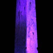 Caribbean Calcite obelisk 95*40*44mm 571g in UV light - Rocks and Things Store