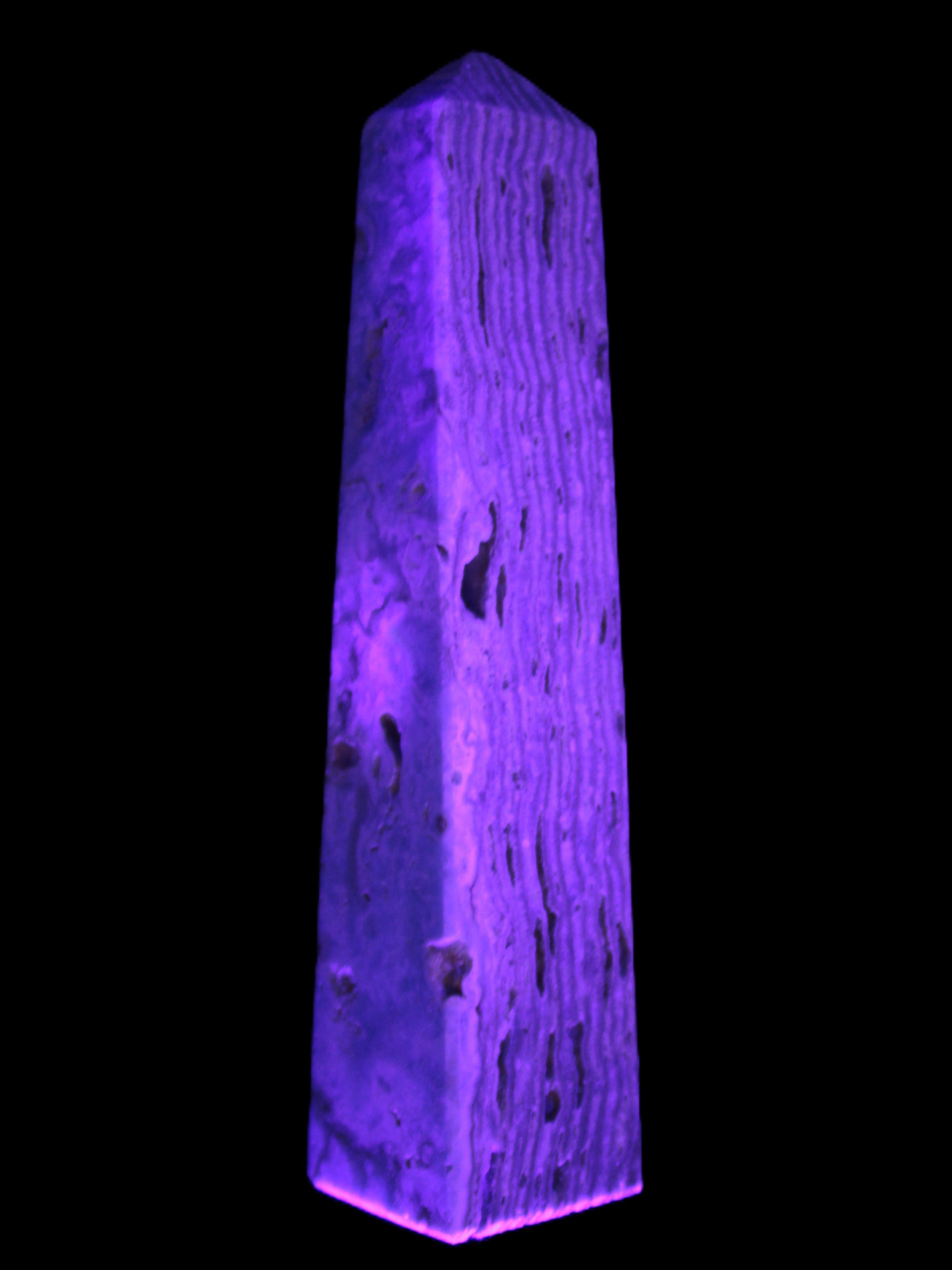 Caribbean Calcite obelisk 95*40*44mm 571g in UV light - Rocks and Things Store