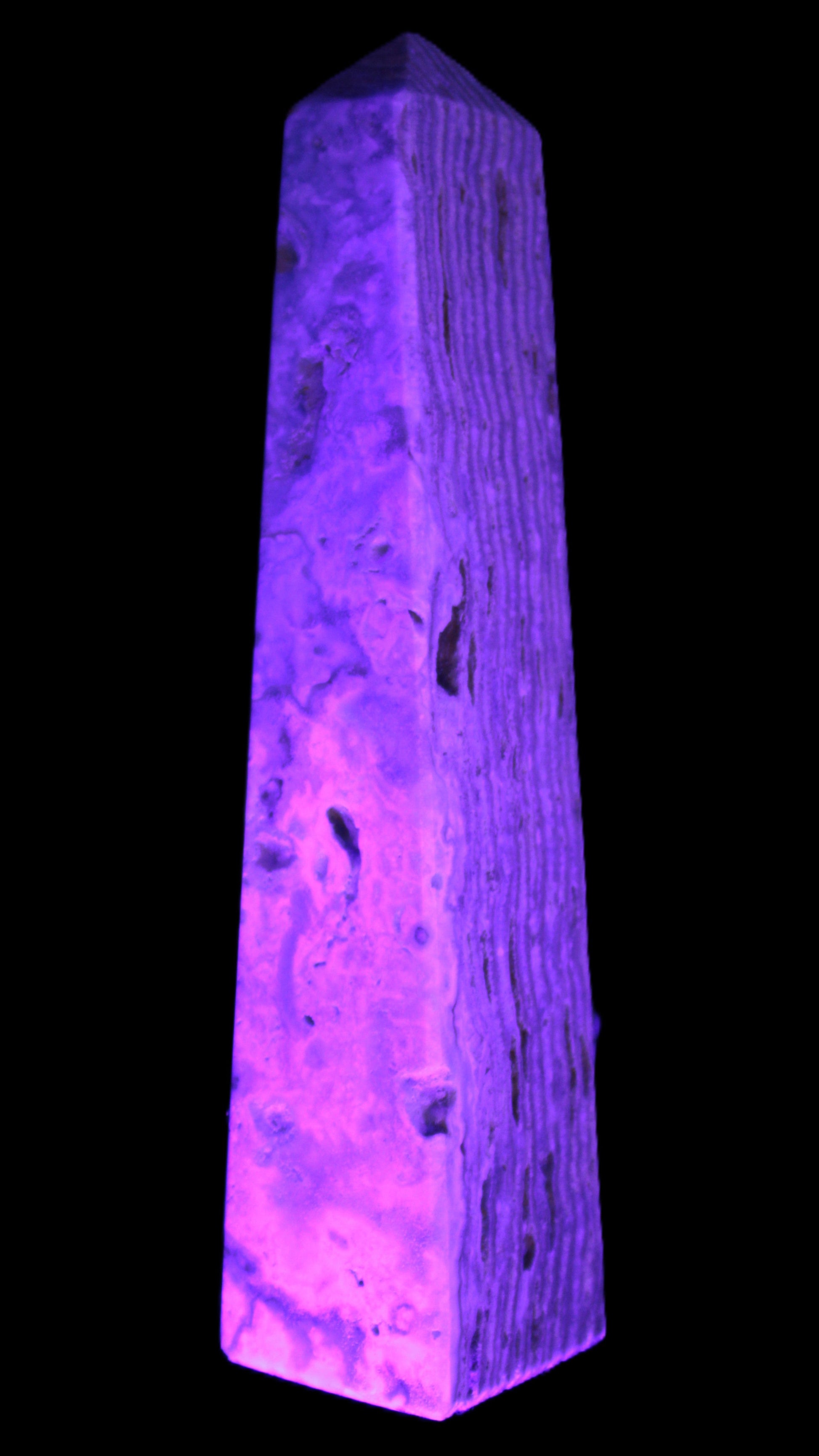Caribbean Calcite obelisk 95*40*44mm 571g in UV light - Rocks and Things Store