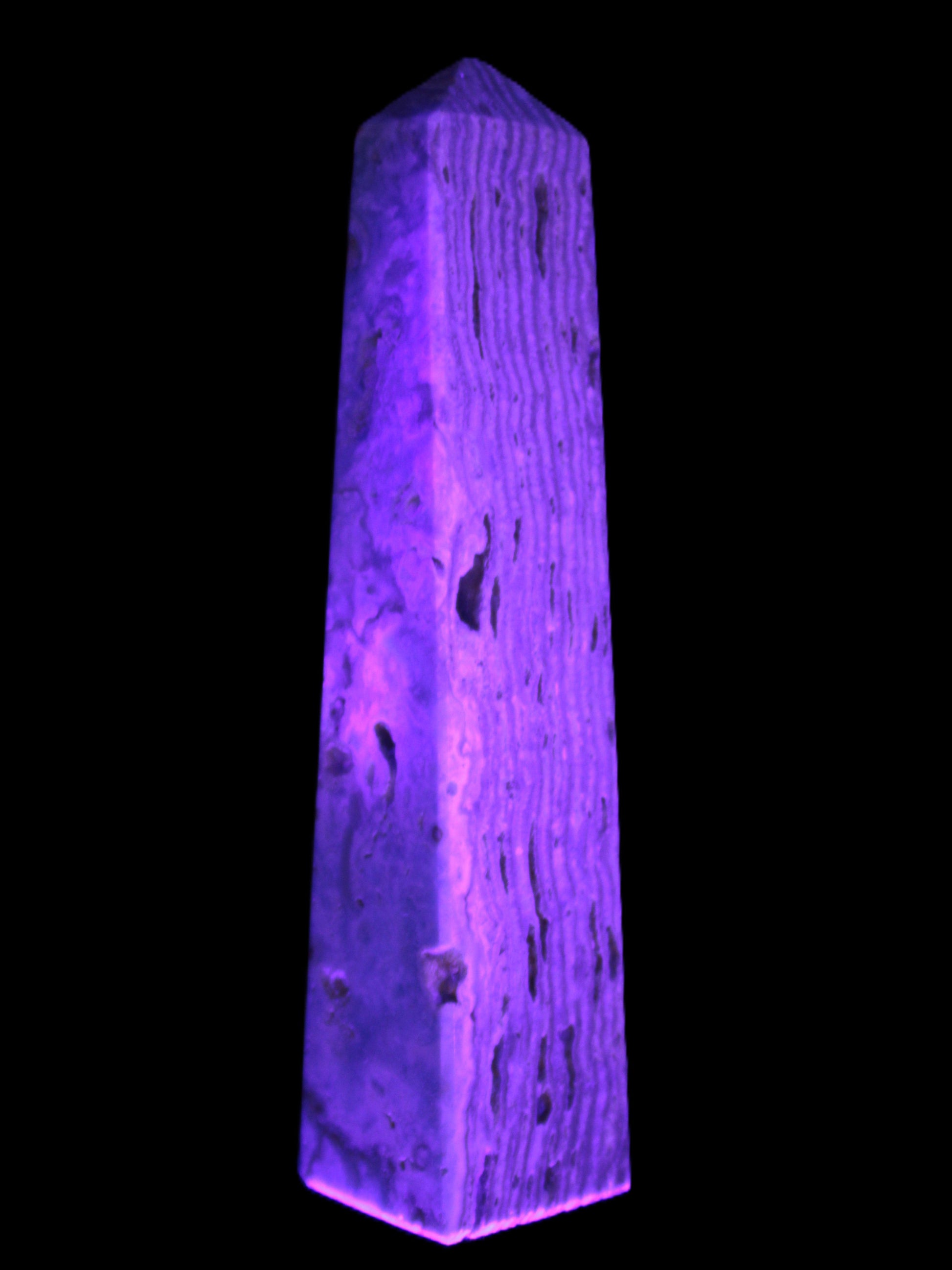 Caribbean Calcite obelisk 95*40*44mm 571g in UV light - Rocks and Things Store