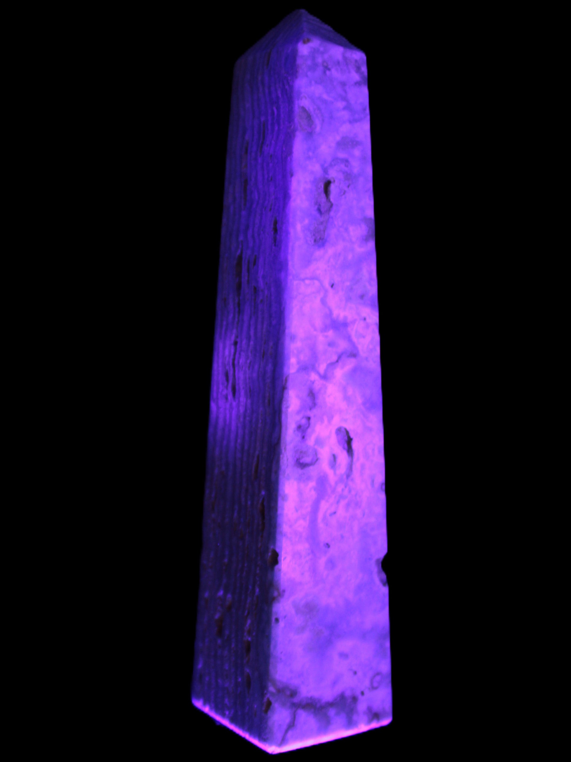 Caribbean Calcite obelisk 95*40*44mm 571g in UV light - Rocks and Things Store