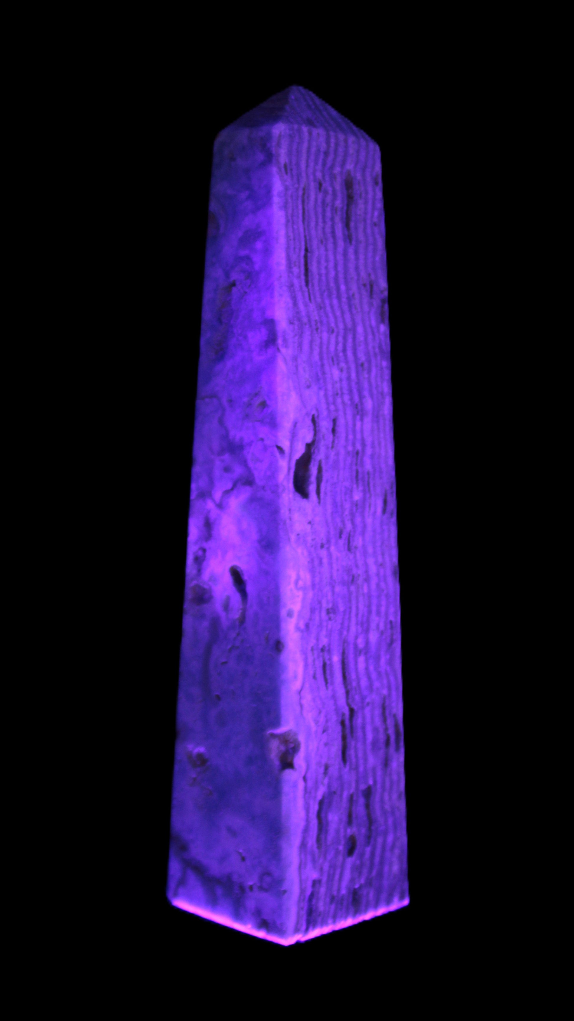 Caribbean Calcite obelisk 95*40*44mm 571g in UV light - Rocks and Things Store