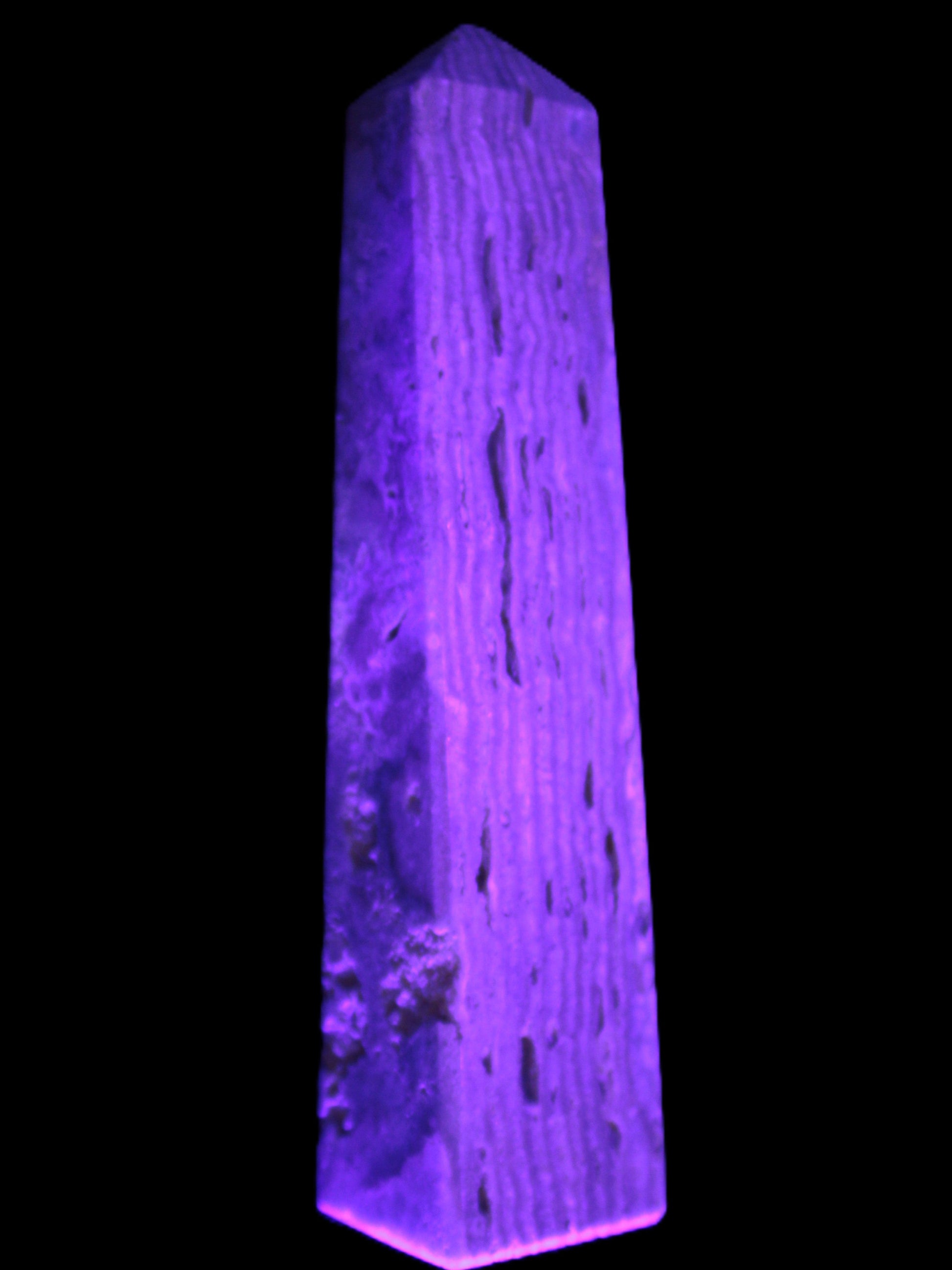 Caribbean Calcite obelisk 95*40*44mm 571g in UV light - Rocks and Things Store