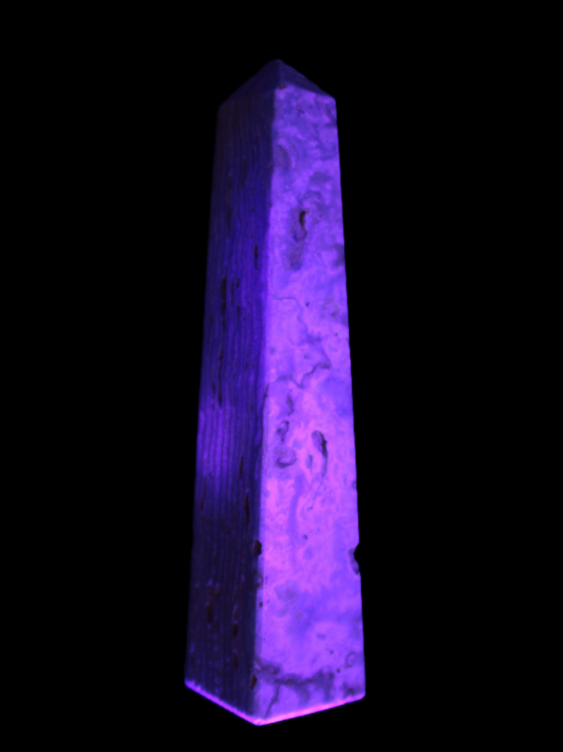 Caribbean Calcite obelisk 95*40*44mm 571g in UV light - Rocks and Things Store