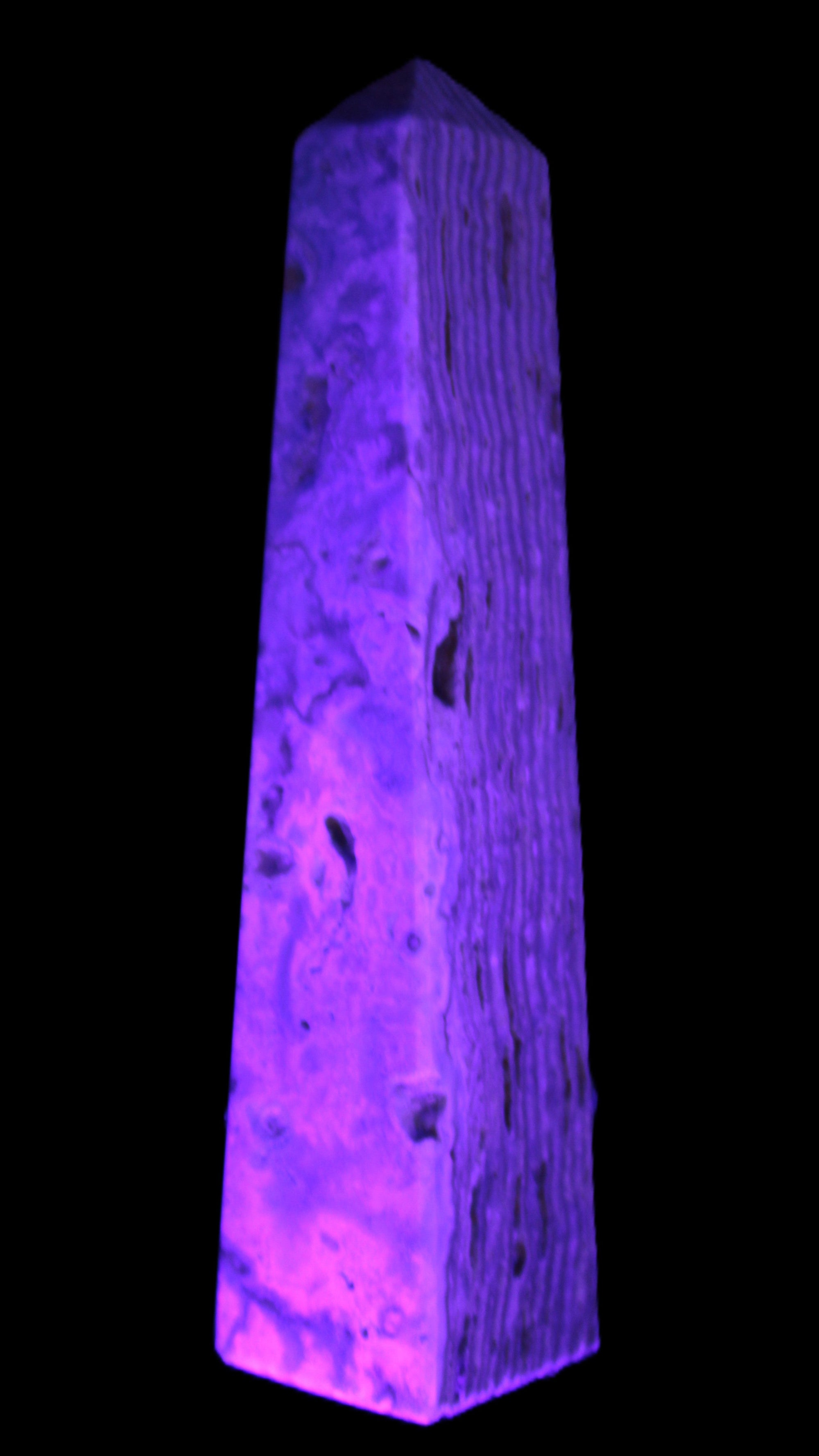 Caribbean Calcite obelisk 95*40*44mm 571g in UV light - Rocks and Things Store