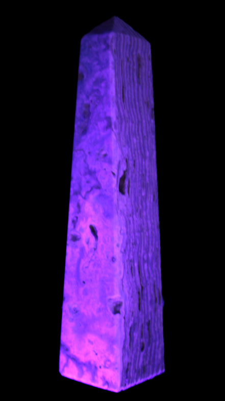 Caribbean Calcite obelisk 95*40*44mm 571g in UV light - Rocks and Things Store