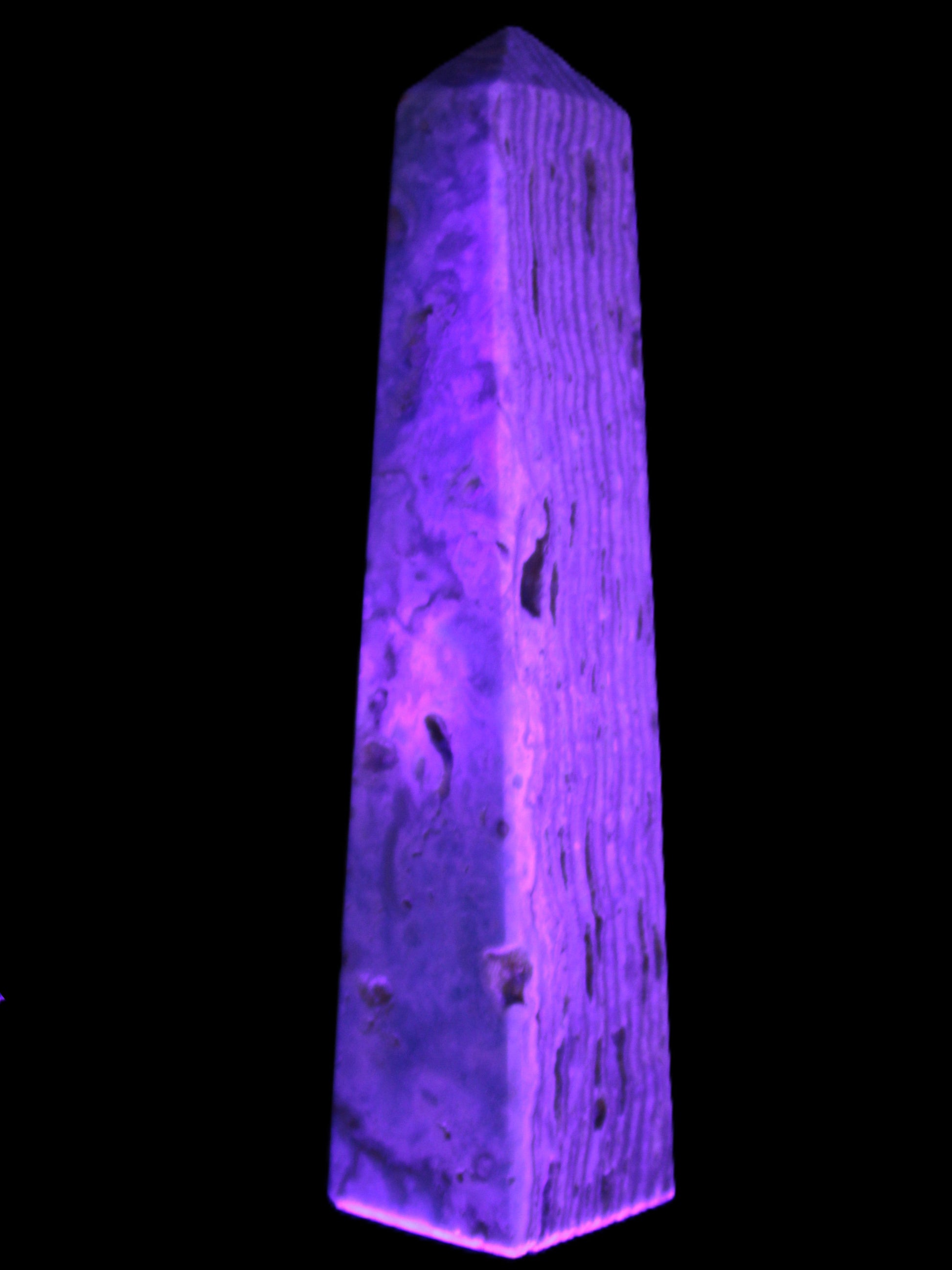 Caribbean Calcite obelisk 95*40*44mm 571g in UV light - Rocks and Things Store