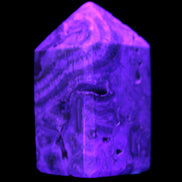 Caribbean Calcite obelisk 55*26*29mm 94g in UV light -  Rocks and Things Store