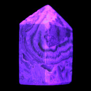 Caribbean Calcite obelisk 55*26*29mm 94g in UV light -  Rocks and Things Store