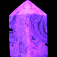 Caribbean Calcite obelisk 55*26*29mm 94g in UV light -  Rocks and Things Store