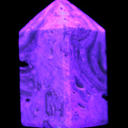 Caribbean Calcite obelisk 55*26*29mm 94g in UV light -  Rocks and Things Store