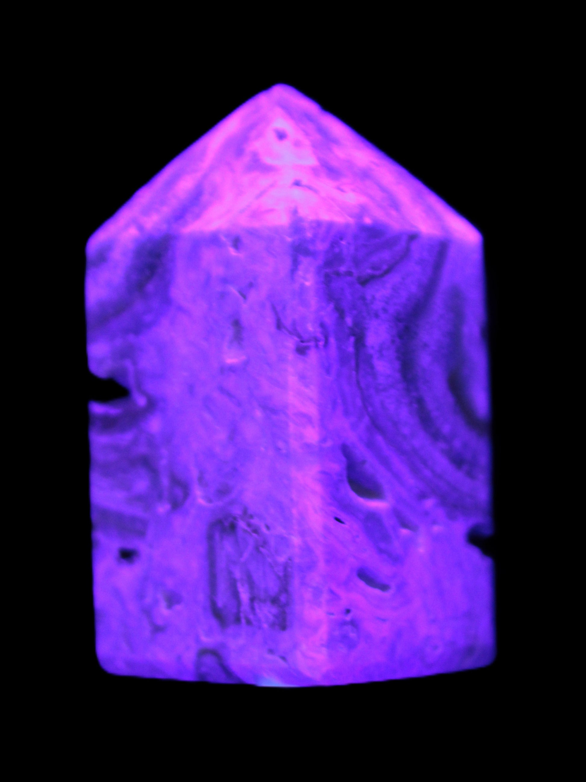 Caribbean Calcite obelisk 55*26*29mm 94g in UV light -  Rocks and Things Store