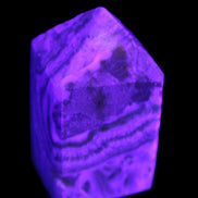 Caribbean Calcite obelisk 55*26*29mm 94g in UV light -  Rocks and Things Store