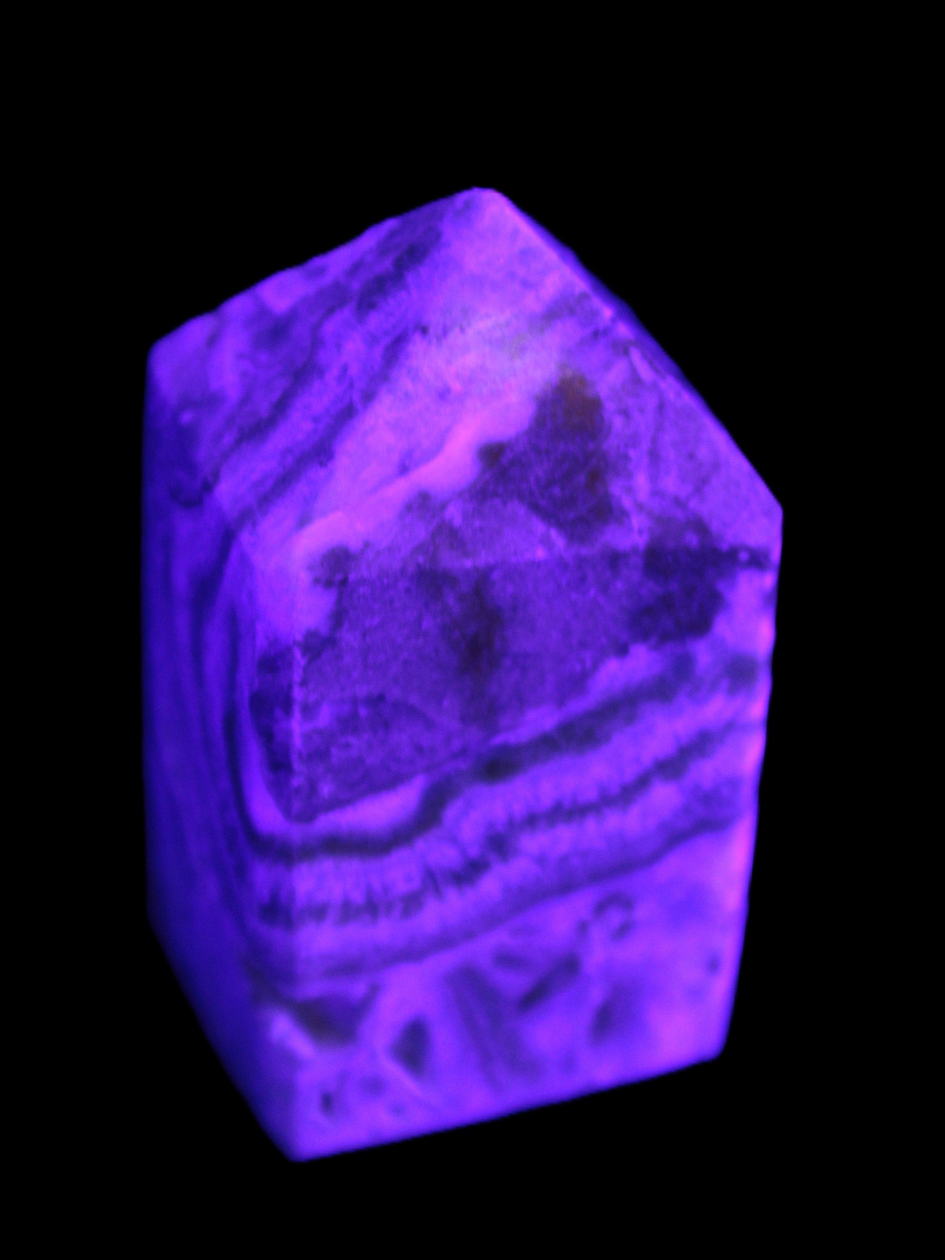 Caribbean Calcite obelisk 55*26*29mm 94g in UV light -  Rocks and Things Store