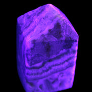 Caribbean Calcite obelisk 55*26*29mm 94g in UV light -  Rocks and Things Store