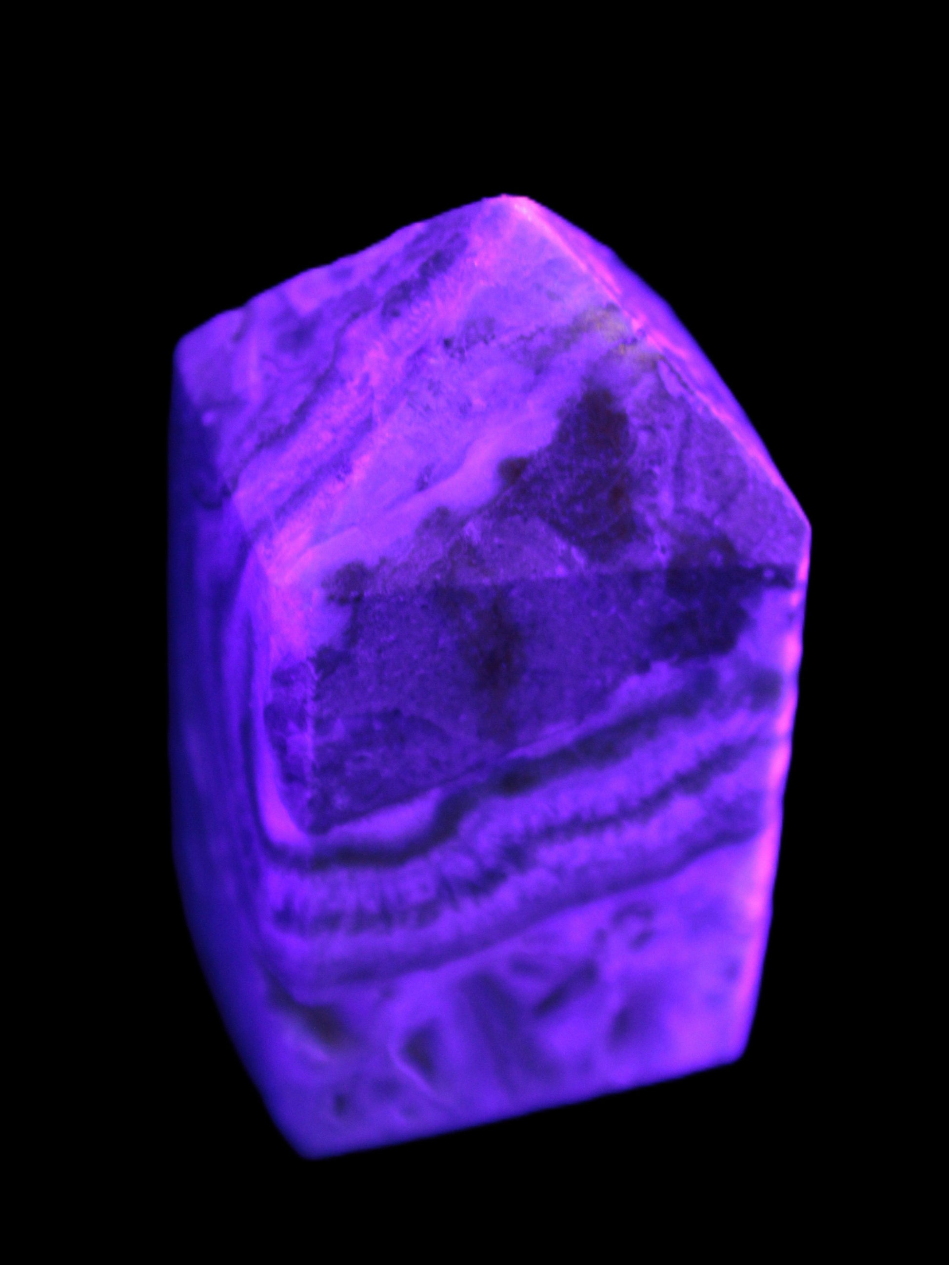 Caribbean Calcite obelisk 55*26*29mm 94g in UV light -  Rocks and Things Store