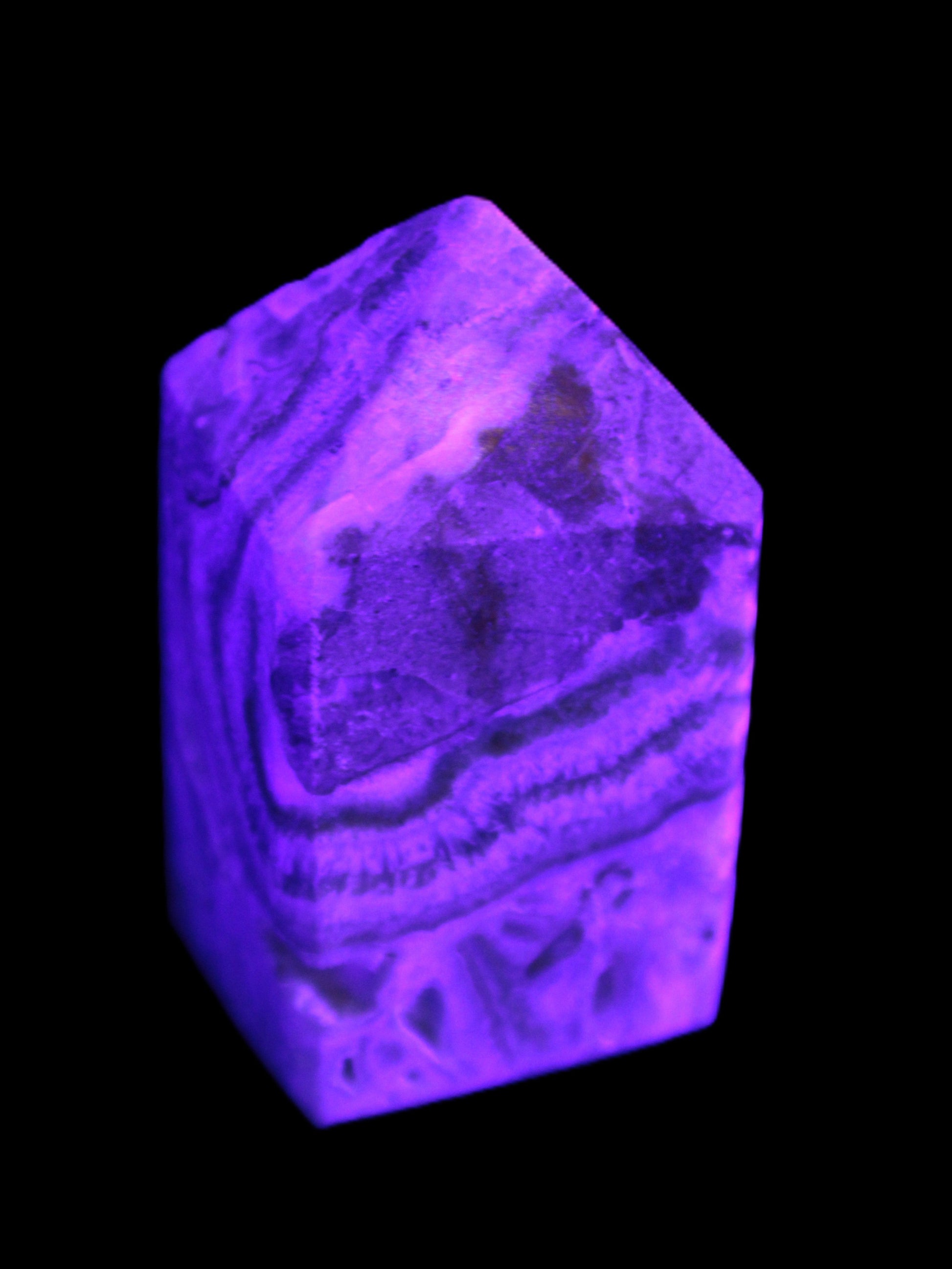 Caribbean Calcite obelisk 55*26*29mm 94g in UV light -  Rocks and Things Store