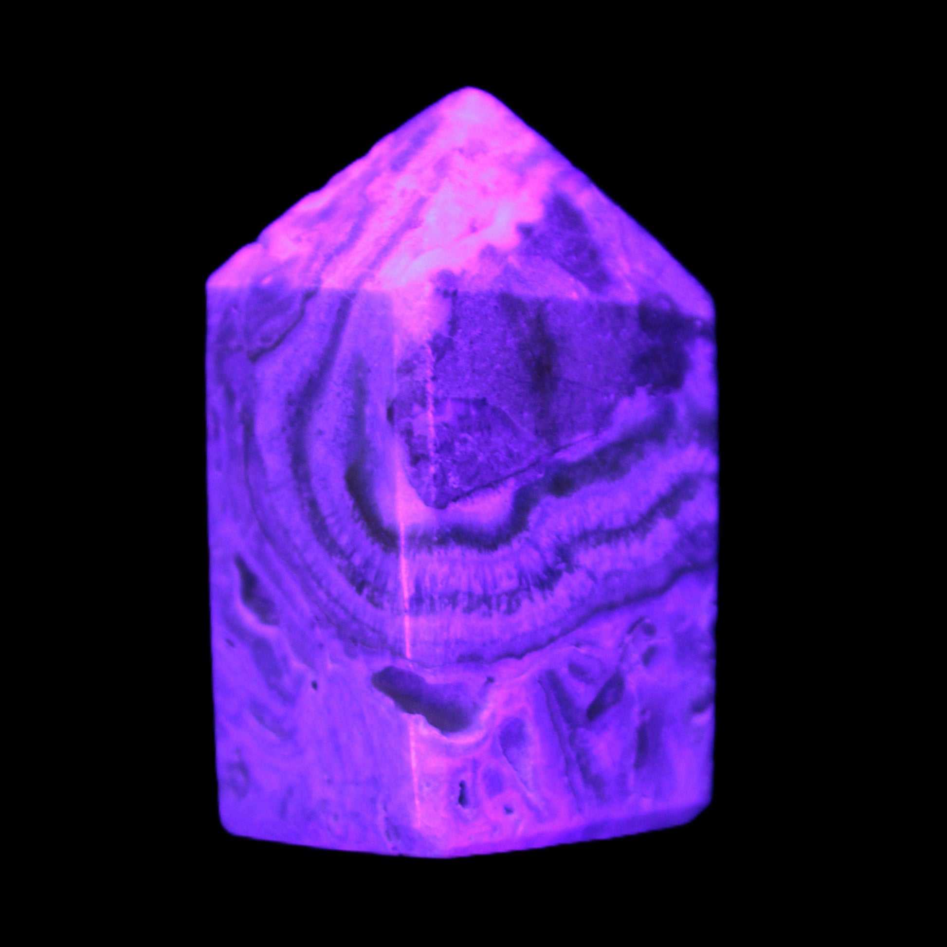Caribbean Calcite obelisk 55*26*29mm 94g in UV light -  Rocks and Things Store