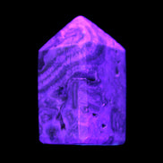 Caribbean Calcite obelisk 55*26*29mm 94g in UV light -  Rocks and Things Store