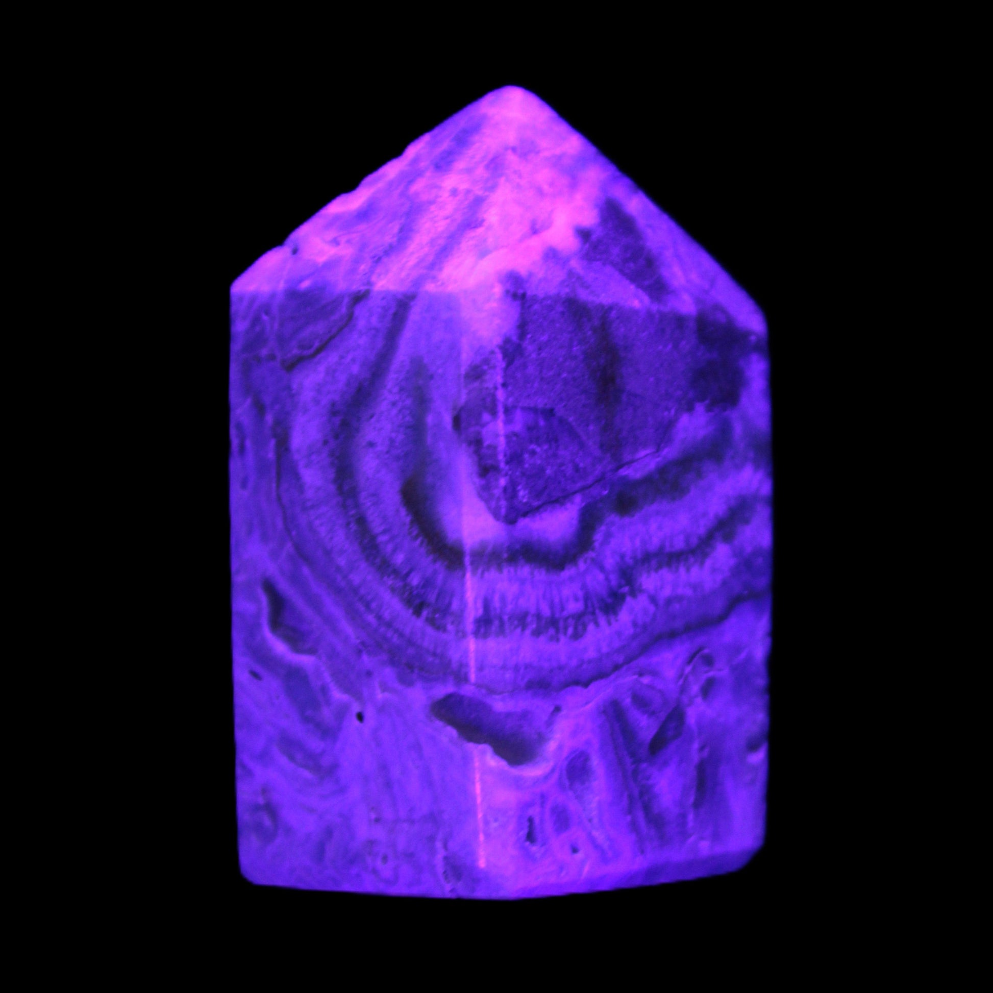 Caribbean Calcite obelisk 55*26*29mm 94g in UV light -  Rocks and Things Store