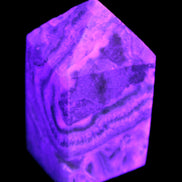 Caribbean Calcite obelisk 55*26*29mm 94g in UV light -  Rocks and Things Store