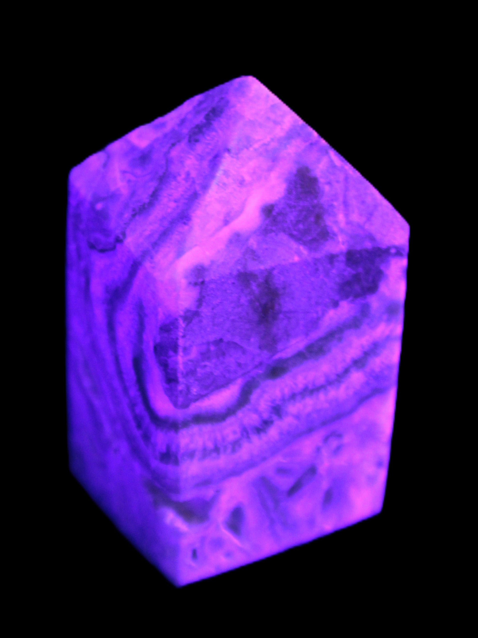 Caribbean Calcite obelisk 55*26*29mm 94g in UV light -  Rocks and Things Store