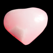 Pink-dyed Calcite heart 55*56mm 124.6g in sunlight - Rocks and Things Store