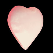 Pink-dyed Calcite heart 55*56mm 124.6g in sunlight - Rocks and Things Store