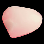 Pink-dyed Calcite heart 55*56mm 124.6g in sunlight - Rocks and Things Store