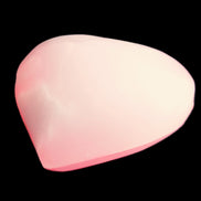 Pink-dyed Calcite heart 55*56mm 124.6g in sunlight - Rocks and Things Store