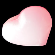 Pink-dyed Calcite heart 55*56mm 124.6g in sunlight - Rocks and Things Store