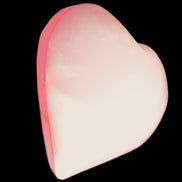 Pink-dyed Calcite heart 55*56mm 124.6g in sunlight - Rocks and Things Store