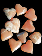 Ten Honey Calcite hearts selection 53-60mm 969g Wholesale Rocks and Things Store